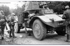German-soldiers-captured-french-armored-amd35-Panhard-178